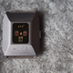 The heart rate sensor. The three small dots are where you connect the charger.
